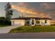 House exterior, single story, white with gray roof and landscaping at 10625 Ayear Rd, Port Charlotte, FL 33981