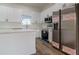 Modern kitchen with stainless steel appliances and white cabinets at 10625 Ayear Rd, Port Charlotte, FL 33981