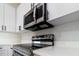 Stainless steel range and microwave installed in modern kitchen at 10625 Ayear Rd, Port Charlotte, FL 33981