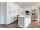 Modern kitchen featuring white cabinetry, quartz countertops, and stainless steel appliances at 10625 Ayear Rd, Port Charlotte, FL 33981