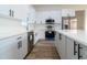 Modern kitchen with white cabinets and stainless steel appliances at 10625 Ayear Rd, Port Charlotte, FL 33981