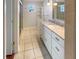 Updated bathroom with granite countertop, double sinks, and a large shower at 2253 Heron Cir, Clearwater, FL 33762