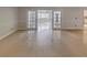 Bright living room with tile floors and access to other rooms at 2253 Heron Cir, Clearwater, FL 33762
