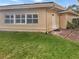 Side yard with a pathway leading to a private gated entrance at 2253 Heron Cir, Clearwater, FL 33762