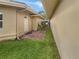 Side yard with a pathway leading to a private gated entrance at 2253 Heron Cir, Clearwater, FL 33762