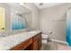 Bathroom with shower and granite countertop at 9231 Freedom Hill Dr, Seffner, FL 33584