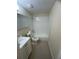 Updated bathroom with white tile and vanity at 4944 Hazner St # 4944, New Port Richey, FL 34652