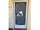 White metal front door with dolphin design at 4944 Hazner St # 4944, New Port Richey, FL 34652