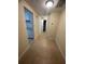 Bright hallway with tile flooring and access to other rooms at 4944 Hazner St # 4944, New Port Richey, FL 34652