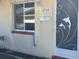 Tan house exterior with a white door and mailbox at 4944 Hazner St # 4944, New Port Richey, FL 34652