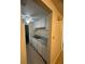 White kitchen cabinets, granite countertops and a double sink at 4944 Hazner St # 4944, New Port Richey, FL 34652