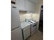 Kitchen features white cabinets, granite countertops, and appliances at 4944 Hazner St # 4944, New Port Richey, FL 34652