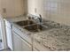 Kitchen with double sink and granite countertop at 4944 Hazner St # 4944, New Port Richey, FL 34652