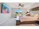 Bright bedroom with a king-size bed and scenic view from large windows at 19335 Eagle Creek Ln, Tampa, FL 33647