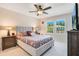 King bedroom with a large dresser and plenty of natural light at 19335 Eagle Creek Ln, Tampa, FL 33647