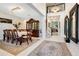 Formal dining room with a large table, hutch, and chandelier at 19335 Eagle Creek Ln, Tampa, FL 33647