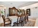 Formal dining room with a large table, hutch, and elegant decor at 19335 Eagle Creek Ln, Tampa, FL 33647