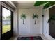 Backyard entry with painted palm trees on sliding doors at 1820 Rising Sun Dr # 4, Holiday, FL 34690