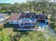 An aerial shot showcasing a single story house with a covered porch at 2809 49Th E St, Palmetto, FL 34221