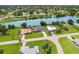 Stunning aerial view of a waterfront neighborhood with lush landscaping and a serene river at 7384 Van Lake Dr, Englewood, FL 34224