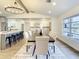 Bright dining area with a farmhouse table and chandelier at 7384 Van Lake Dr, Englewood, FL 34224