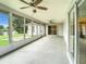 Screened porch with lake view and ceiling fans at 7384 Van Lake Dr, Englewood, FL 34224