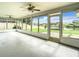 Large screened porch with view of canal and backyard at 7384 Van Lake Dr, Englewood, FL 34224