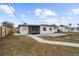 House back view with patio and fenced yard at 240 Algiers Dr, Venice, FL 34293