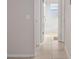 Hallway with tile floors and doors to bedrooms and bath at 7816 Hardwick Dr # 1024, New Port Richey, FL 34653