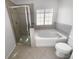 Bathroom boasts a large garden tub, a separate shower, and updated fixtures at 9301 Wellstone Dr, Land O Lakes, FL 34638