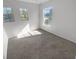 Bright bedroom with two windows and carpet flooring at 9301 Wellstone Dr, Land O Lakes, FL 34638