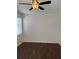 Bedroom with dark laminate wood flooring and ceiling fan at 15126 Searobbin Dr, Lakewood Ranch, FL 34202