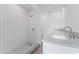Stylish bathroom with white subway tile shower and dual vanity at 18839 Aripeka Rd, Hudson, FL 34667