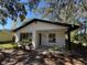 Charming single-story home with a newly painted exterior and modern front porch at 18839 Aripeka Rd, Hudson, FL 34667