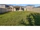 Large backyard with grassy lawn and privacy fence at 6223 Springmont Loop, Palmetto, FL 34221