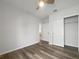 Bedroom with wood flooring, walk-in closet and access to hallway at 6223 Springmont Loop, Palmetto, FL 34221