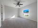 Well-lit bedroom with neutral wall colors and carpet flooring at 6223 Springmont Loop, Palmetto, FL 34221