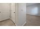 Clean hallway with neutral walls and tile flooring at 6223 Springmont Loop, Palmetto, FL 34221