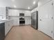 Modern kitchen with white cabinets and stainless steel appliances at 6223 Springmont Loop, Palmetto, FL 34221