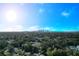 Aerial view of neighborhood with city skyline in the distance at 817 W Fribley St, Tampa, FL 33603