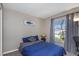 Guest bedroom with a comfortable bed, window, and desk at 1315 Gangplank Dr, Valrico, FL 33594