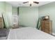 Spacious bedroom with large bed, dresser, and mirrored closet at 4654 Copper Ln, Plant City, FL 33566