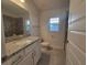 Bathroom with granite countertop and gray tile at 7006 162Nd E Pl, Parrish, FL 34219