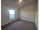 Spacious bedroom with grey carpet and large window at 7006 162Nd E Pl, Parrish, FL 34219