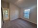 Bright bedroom featuring grey carpet and a window at 7006 162Nd E Pl, Parrish, FL 34219