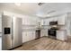 Modern kitchen with stainless steel appliances and white cabinets at 3517 N 10Th St, Tampa, FL 33605