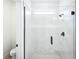 Walk-in shower with frameless glass door in modern bathroom design at 104 Runaway Field Ave, Nokomis, FL 34275
