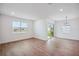 Bright dining room with sliding glass doors and modern light fixture at 117 Runaway Field Ave, Nokomis, FL 34275