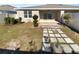 Landscaped backyard with a patio and some small trees at 17827 Turning Leaf Cir, Land O Lakes, FL 34638