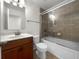 Clean bathroom with a single vanity, shower/tub combo, and tile flooring at 8863 White Sage Loop, Lakewood Ranch, FL 34202